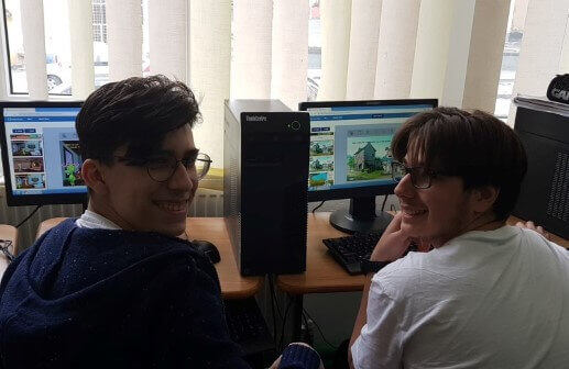 Two students working together on their stories in the studio